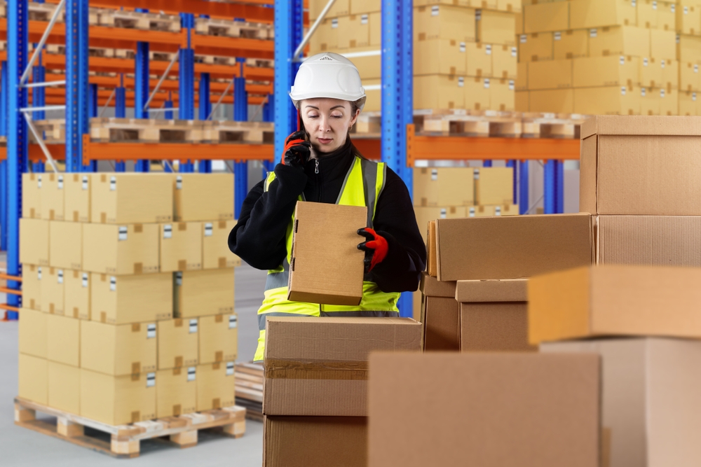 Customs,Registration.,Woman,With,Phone,In,Warehouse.,Woman,Works,At