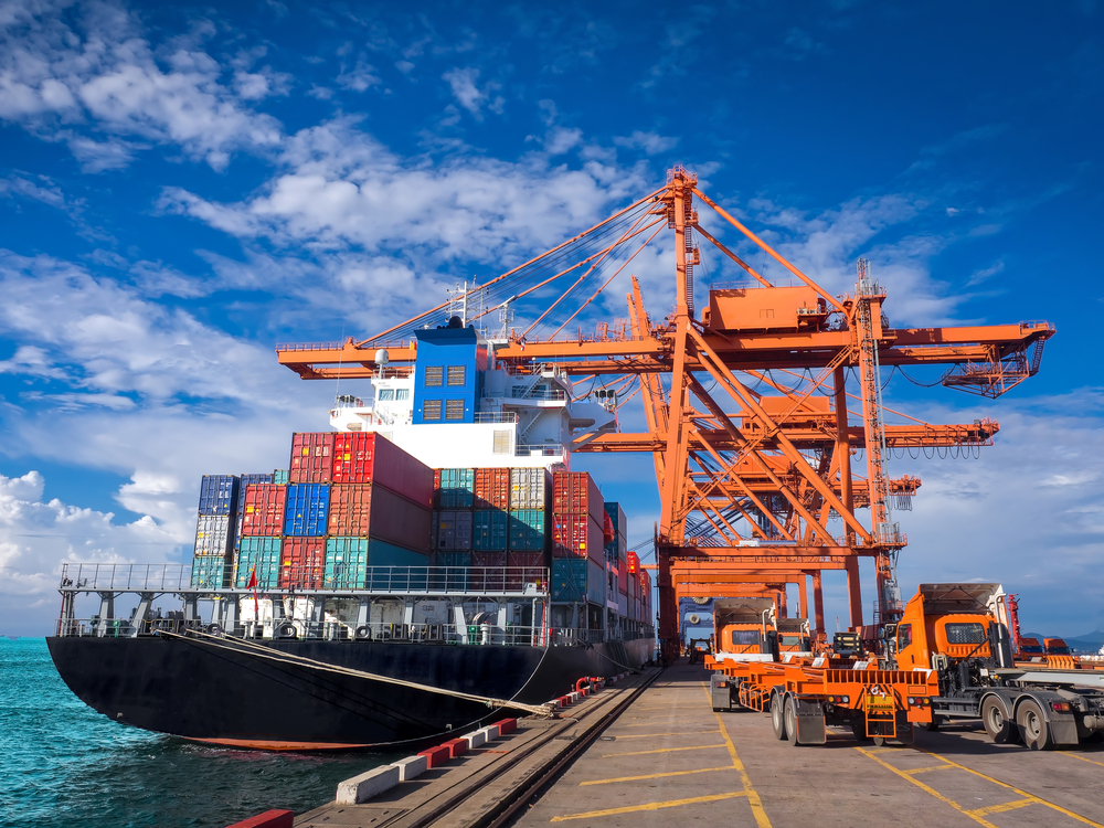 The,Container,Vessel,During,Discharging,At,An,Industrial,Port,And
